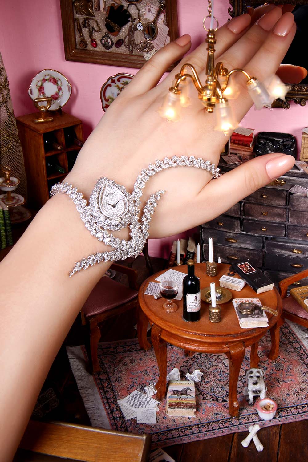 Yeprem Watches Photoshoot by Paradis Socials - Women's Diamond watch on a models hand with a miniature to life concept and pink background - paradissocials.com - Andrew Atamian