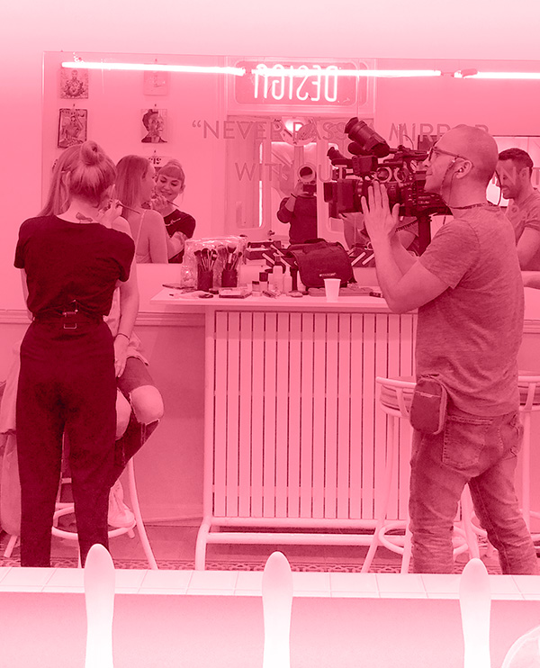 Experts at work filming and preparing the model for a photoshoot at Paradis Socials